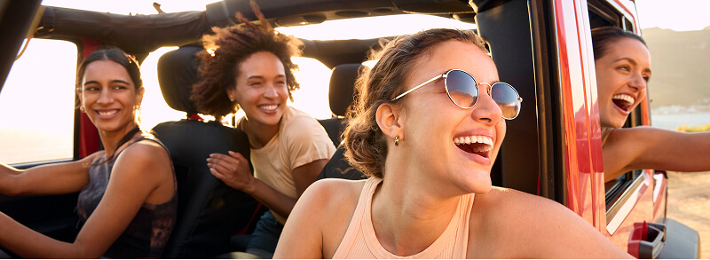 Friends laughing in a car